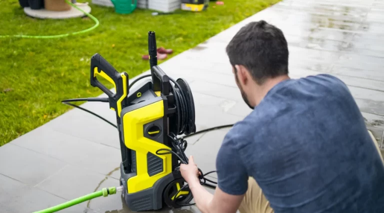 man setting up a power washing equipment